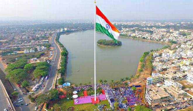 Proud moment: The 110 m tall monumental flag being inaugurated by district in-charge Ramesh Jarkiholi in Belagavi on Monday. 