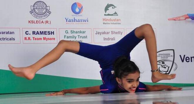 Tanushree performing full-body revolutions maintaining a chest stand position in Udupi on Saturday. | Photo Credit: Special Arrangement