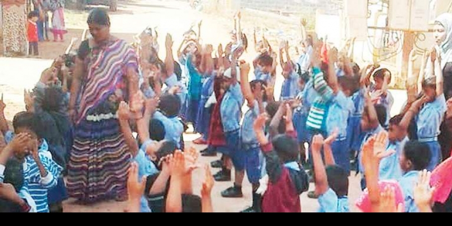 Students attend a PT class in Bapuji Vidyaniketan school.