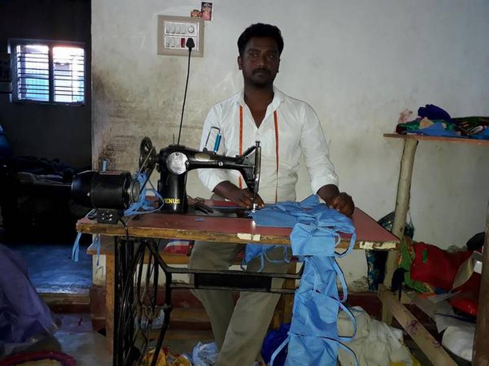 Physically challenged tailor N. Manjunath of Bommenahalli in K.R. Pet taluk of Mandya district.   | Photo Credit: Special Arrangement